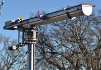 Vertical Shaftless Screw Conveyor with Pivoting Load-Out Conveyor for Biosolids