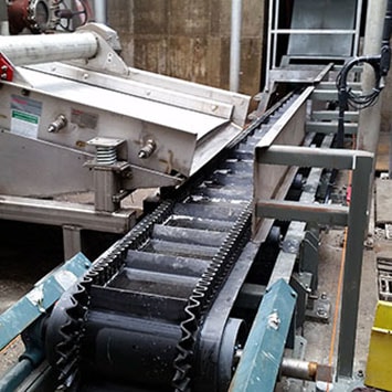 Flex-Wall Belt Wall Conveyor to Remove Food Waste for Hanover Foods in Hanover, PA