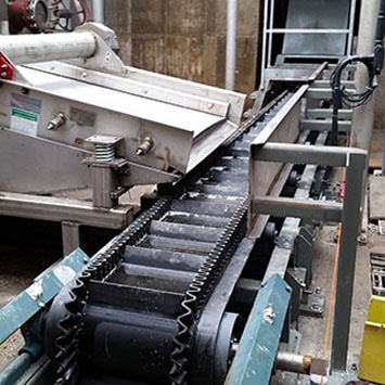 Flex-Wall Belt Wall Conveyor to Remove Food Waste for Hanover Foods in Hanover, PA - KWS Manufacturing