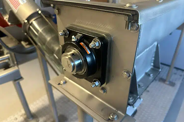 Plate Seal Mounts Between Trough End and Flanged Bearing