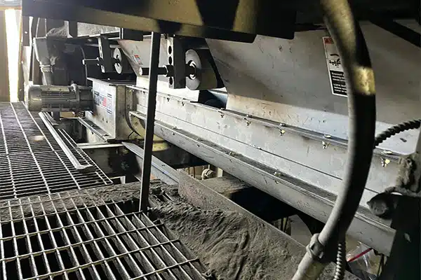 New KWS Twin Screw Conveyor Catches Copper Concentrate Dribble from Belt Conveyor