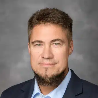 Jwg Headshot - Blue Background - KWS Manufacturing Company, LLC