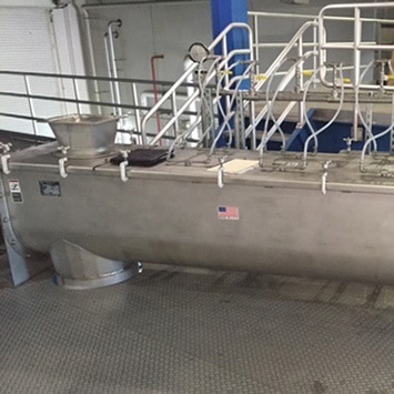 Continuous Paddle Mixer for Blending Dried Sludge Pellets with Liquid Chemicals at the Stickney WWTP in Cicero, IL - KWS Manufacturing