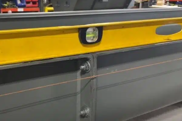 Use Level to Check Levelness at Each Trough Joint - Along Trough Joint