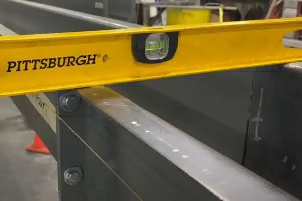 Use Level to Check Levelness at Each Trough Joint - Along Trough Joint