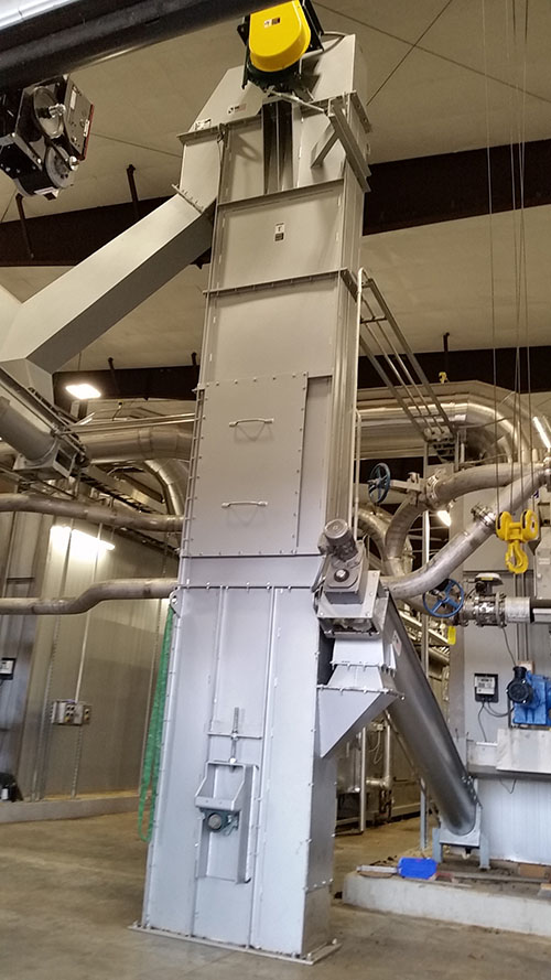 Redundant Dryers Discharge Biosolids to Screw Conveyors and Bucket Elevators