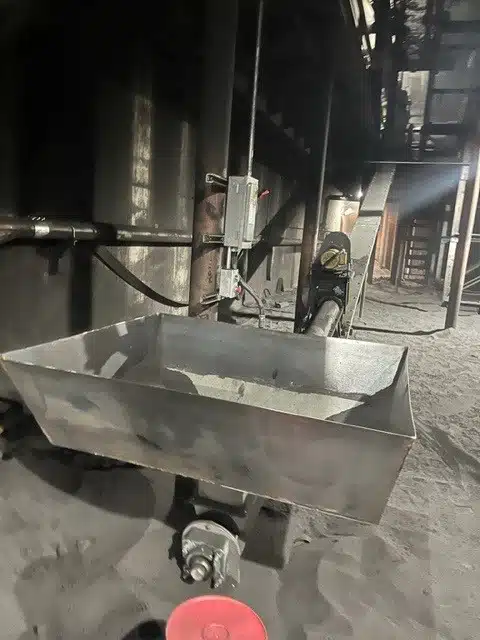 Iron Silica Powder is Dumped into Screw Feeder Hopper with Front-End Loaders
