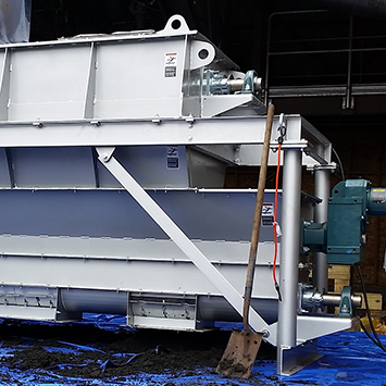 Custom-Designed Screw Feeder with Hopper to Distribute Dewatered Biosolids to Belt Dryer for Pottstown, PA