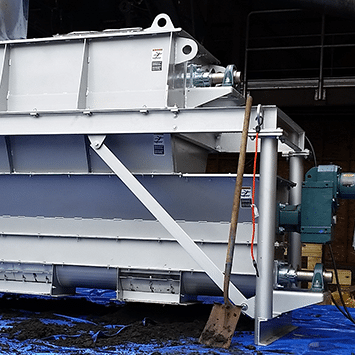 Custom-Designed Screw Feeder with Hopper to Distribute Dewatered Biosolids to Belt Dryer for Pottstown, PA - KWS Manufacturing