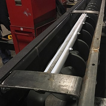 Inclined Shaftless Screw Conveyor for Metal Cuttings - KWS Manufacturing