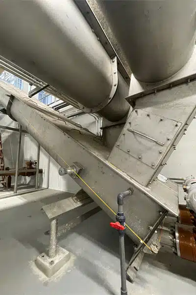 Rigid Chutes Connect Transfer Screw Conveyors to Inclined Screw Conveyors