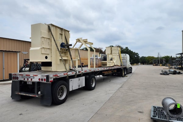 Dedicated Flat Bed Truck is Transporting KWS Bucket Elevator to Owens Brockway in Tracy, CA