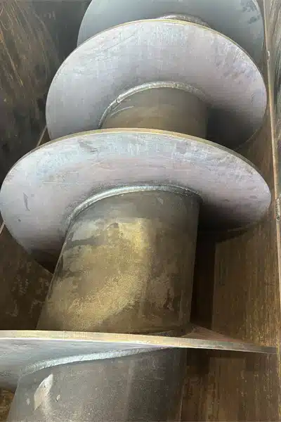 Abrasion Resistant Screws and Troughs Keep Sims Metal Operating Without Downtime